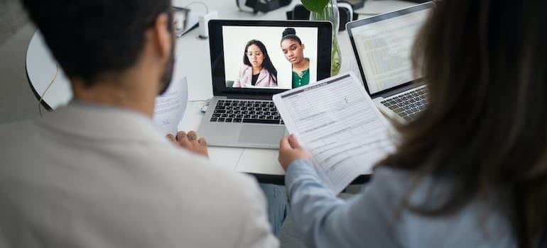 Two people doing an online interview.