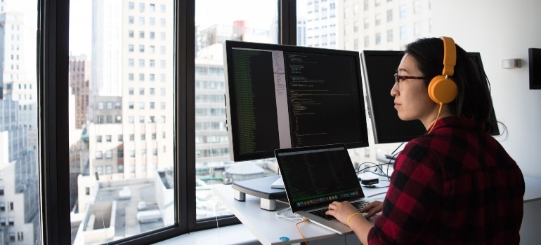 A view of a female developer working in an office