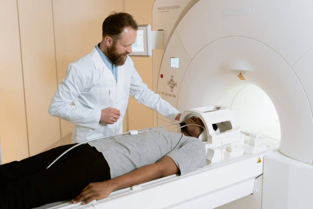 A doctor using MRI with a patient